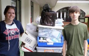 Kandice Squires (CO2016) and Will Hobson moving medical supplies.
